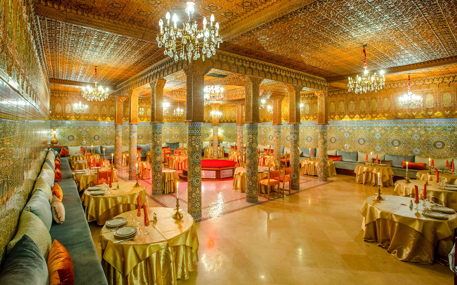 Dar Essalam Moroccan restaurant interior with ornate decor and candlelit tables.