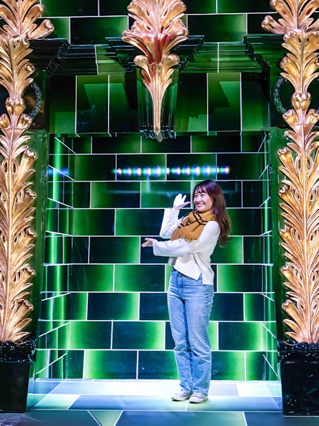 Visitors photographing in the Ministry of Magic at Warner Bros. Studio Tour Tokyo.