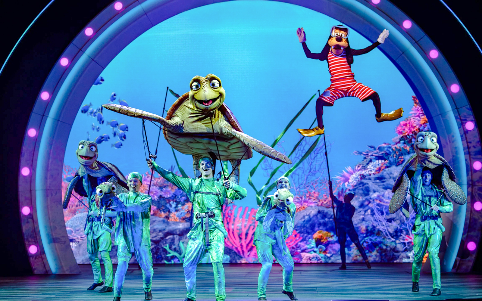 Live performance with sea creature puppets at Disney Adventure Cruise.