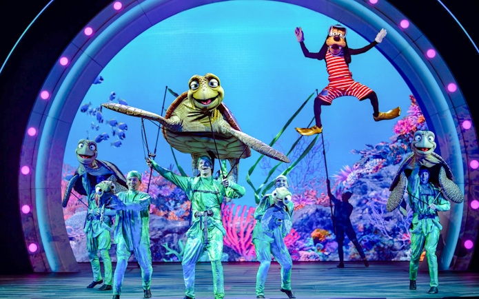 Live performance with sea creature puppets at Disney Adventure Cruise.