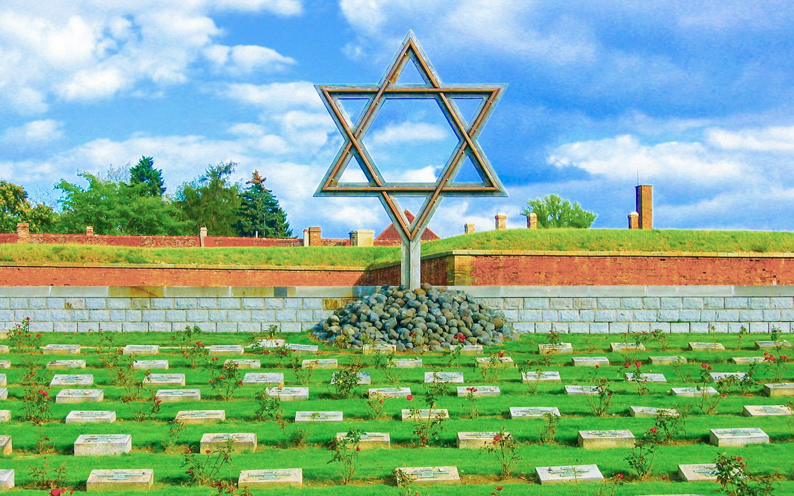 Terezin Cemetery with Star of David memorial and gravestones.