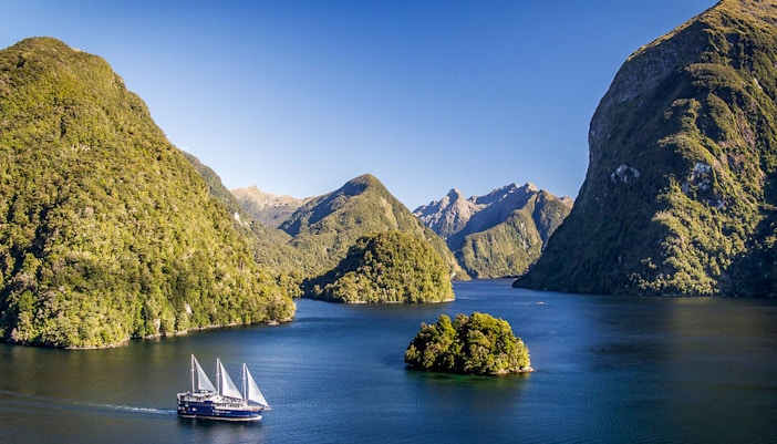 Cruise ship on overnight tour in Doubtful Sound fjord, view from Manapouri.