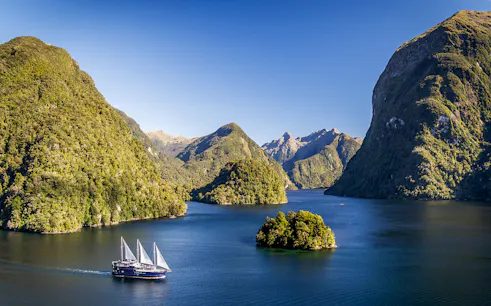 Cruise ship on overnight tour in Doubtful Sound fjord, view from Manapouri.