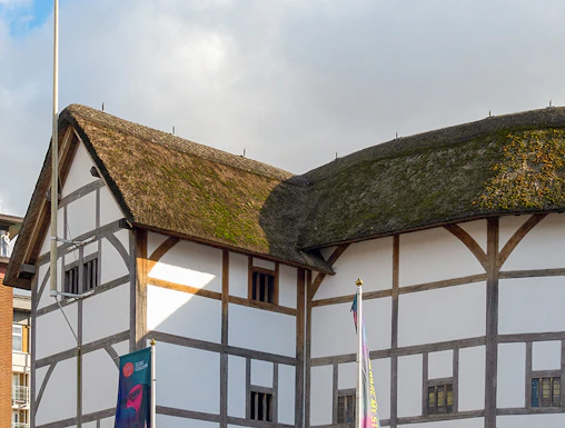 Shakespeare's Globe Theatre exterior with thatched roof in London.