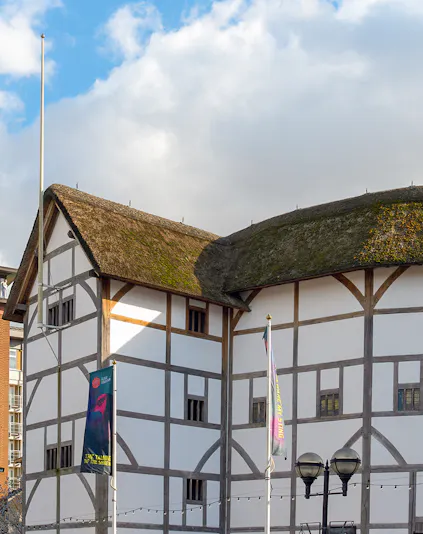 Shakespeare's Globe Theatre exterior with thatched roof in London.