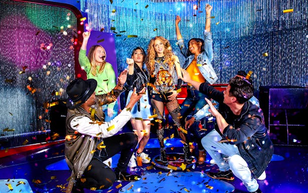 Shakira statue surrounded by visitors at Madame Tussauds Hollywood.