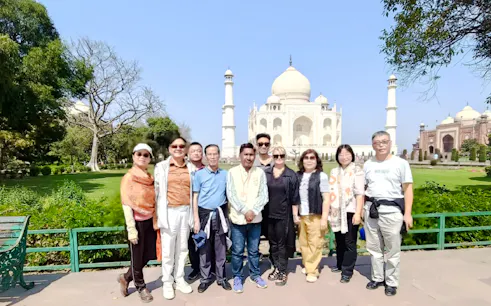 Tour group in front of the Taj Mahal during a private sunrise tour in Agra, India.
