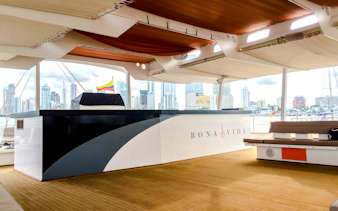 Catamaran deck with open bar and city skyline view in Cartagena.