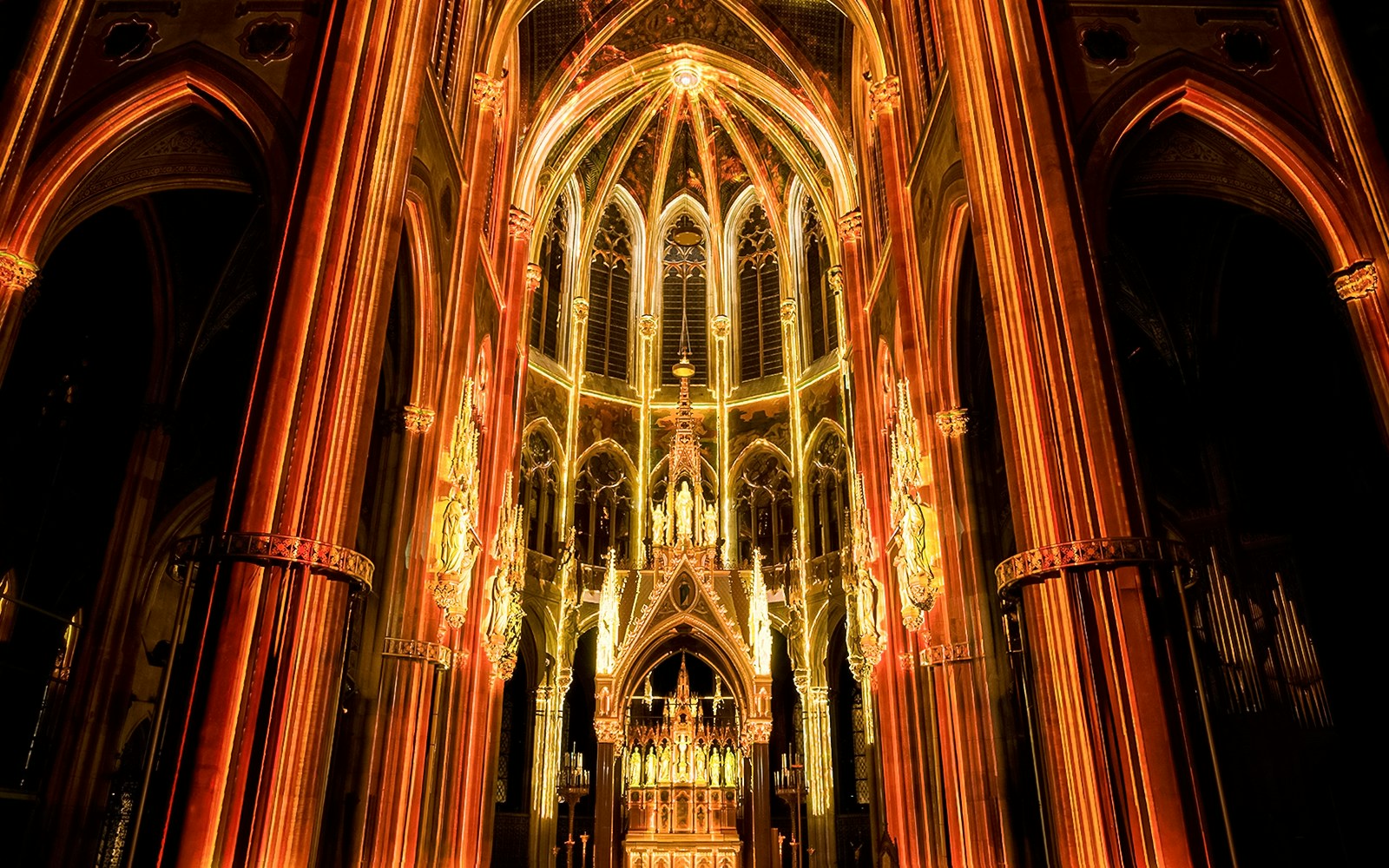 Votivkirche interior illuminated during Light of Creation event in Vienna.