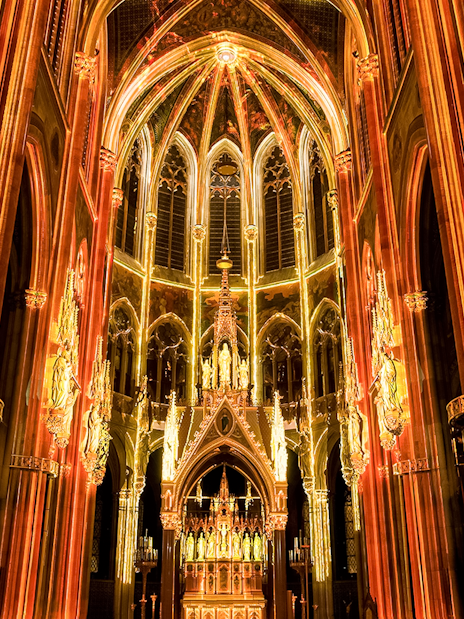 Votivkirche interior illuminated during Light of Creation event in Vienna.