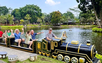 Miniature train ride by a lake at a park in Bandung, Indonesia.