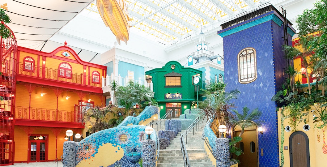 Colorful buildings and mosaic stairs in Ghibli Park, Japan.