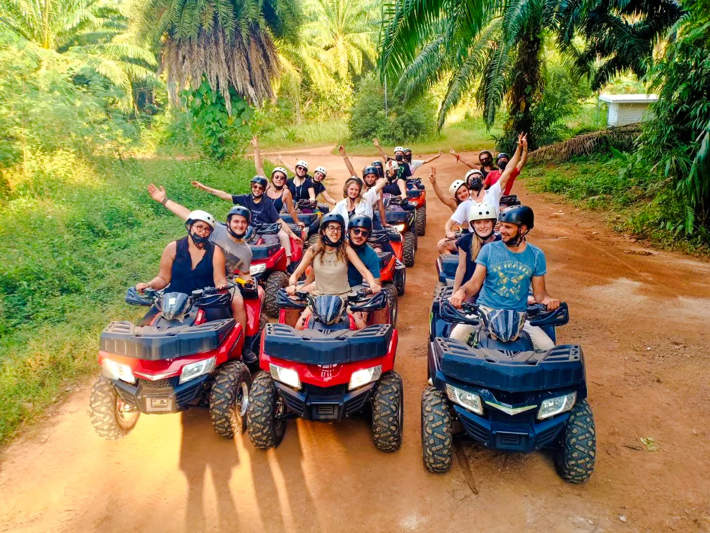 Group enjoying ATV ride through lush forest trail in Krabi.