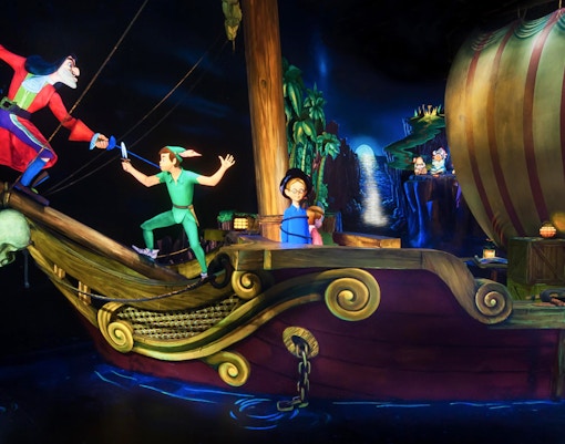 Peter Pan and Captain Hook duel on a pirate ship at Disneyland Paris Peter Pan’s Flight.