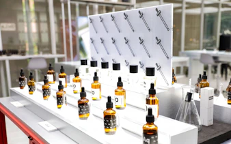 Perfume bottles and droppers on display at Bangkok perfume making workshop.