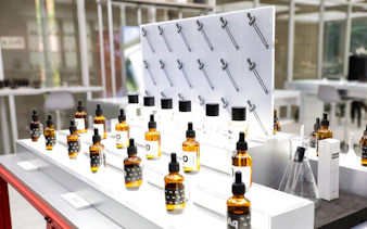 Perfume bottles and droppers on display at Bangkok perfume making workshop.