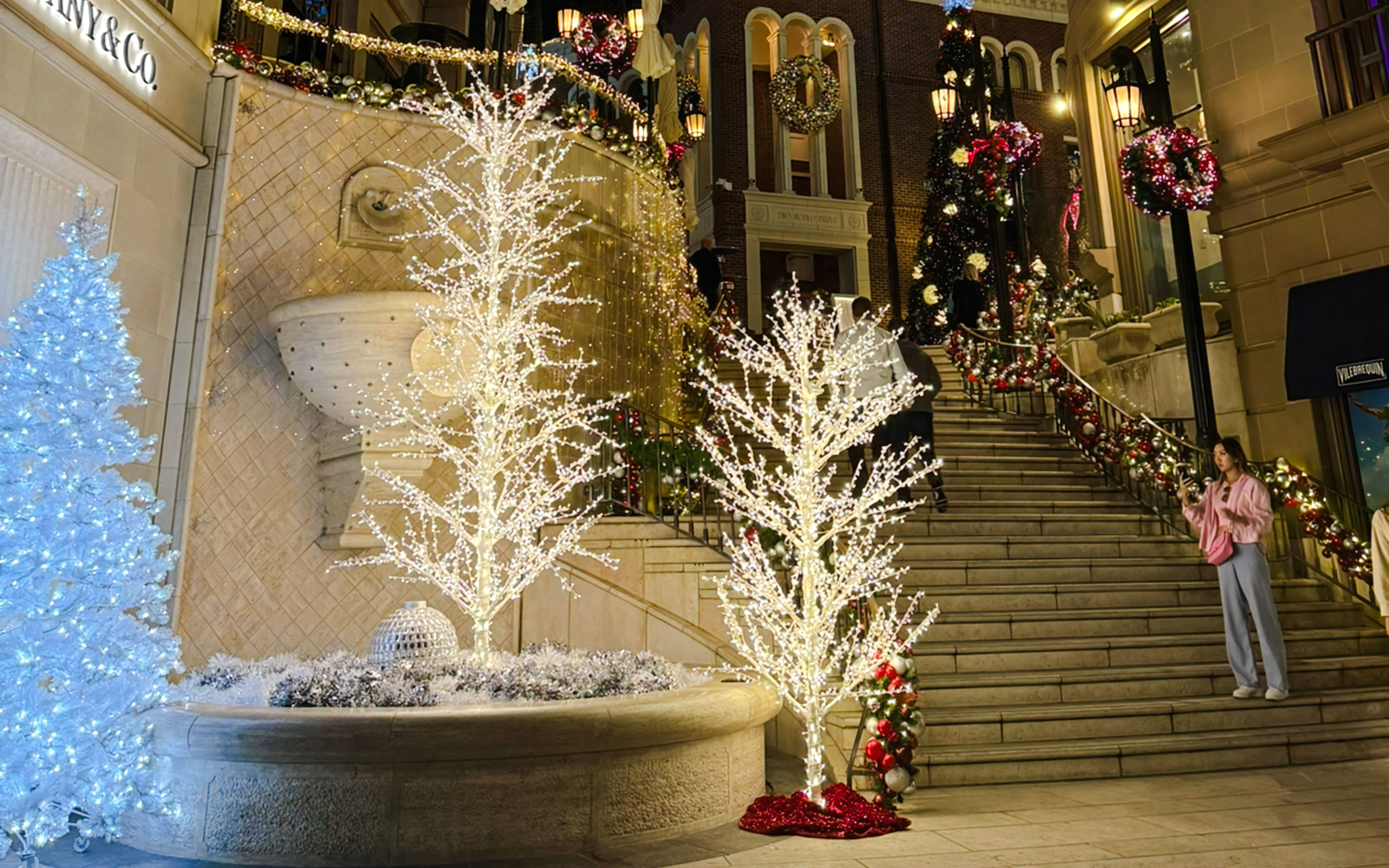 Festive Christmas lights and decorations on stairs at the Grove, Los Angeles.