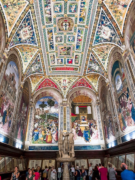 Frescoes and ornate ceiling in Piccolomini Library, Siena Cathedral, Italy.