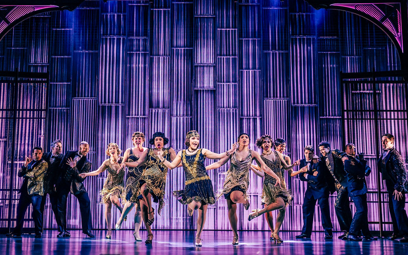 Stage performance of The Great Gatsby in New York with dancers in 1920s attire.