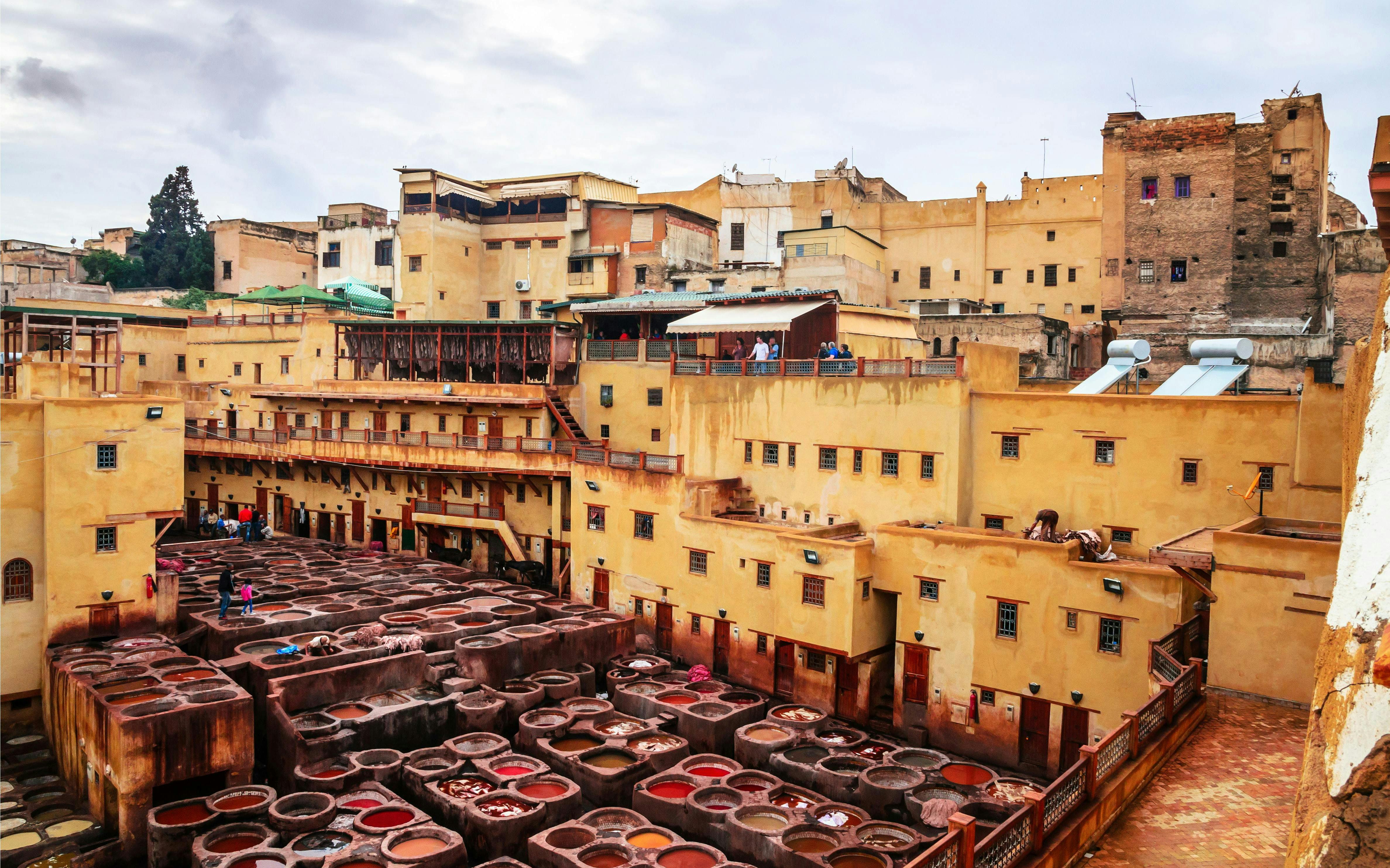 Traditional tannery with dyeing vats in ancient medina of Fez, Morocco.