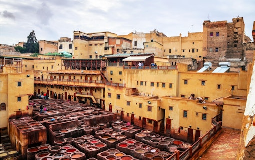 Traditional tannery with dyeing vats in ancient medina of Fez, Morocco.