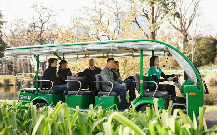 Tour group on electric shuttle in Christchurch Botanic Gardens.