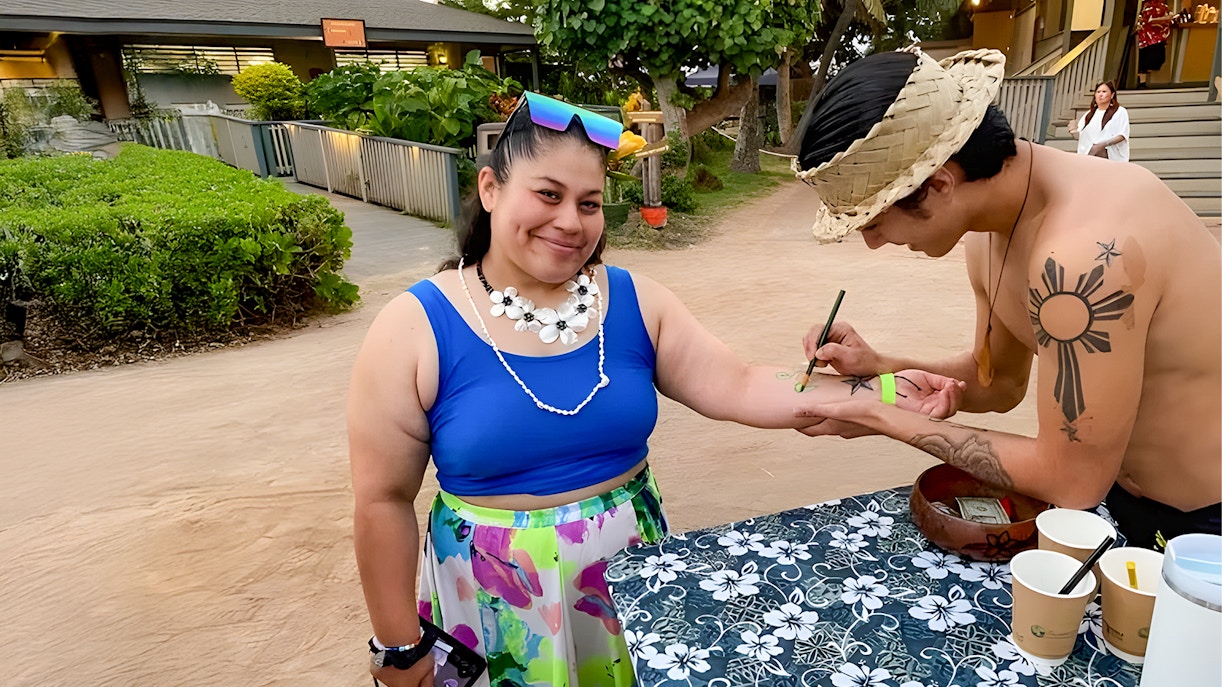 Traditional Hawaiian dancers performing at Germaine's Luau pre-show cultural activities in Oahu, Hawaii.