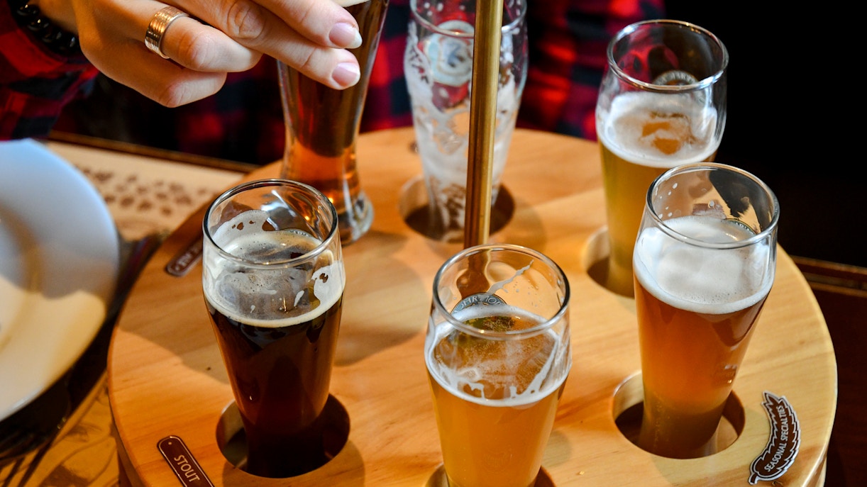 Beer flight with assorted brews at a Prague brewery tasting tour.
