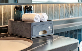 Luxury amenities on a Halong Bay cruise, featuring towels and toiletries.