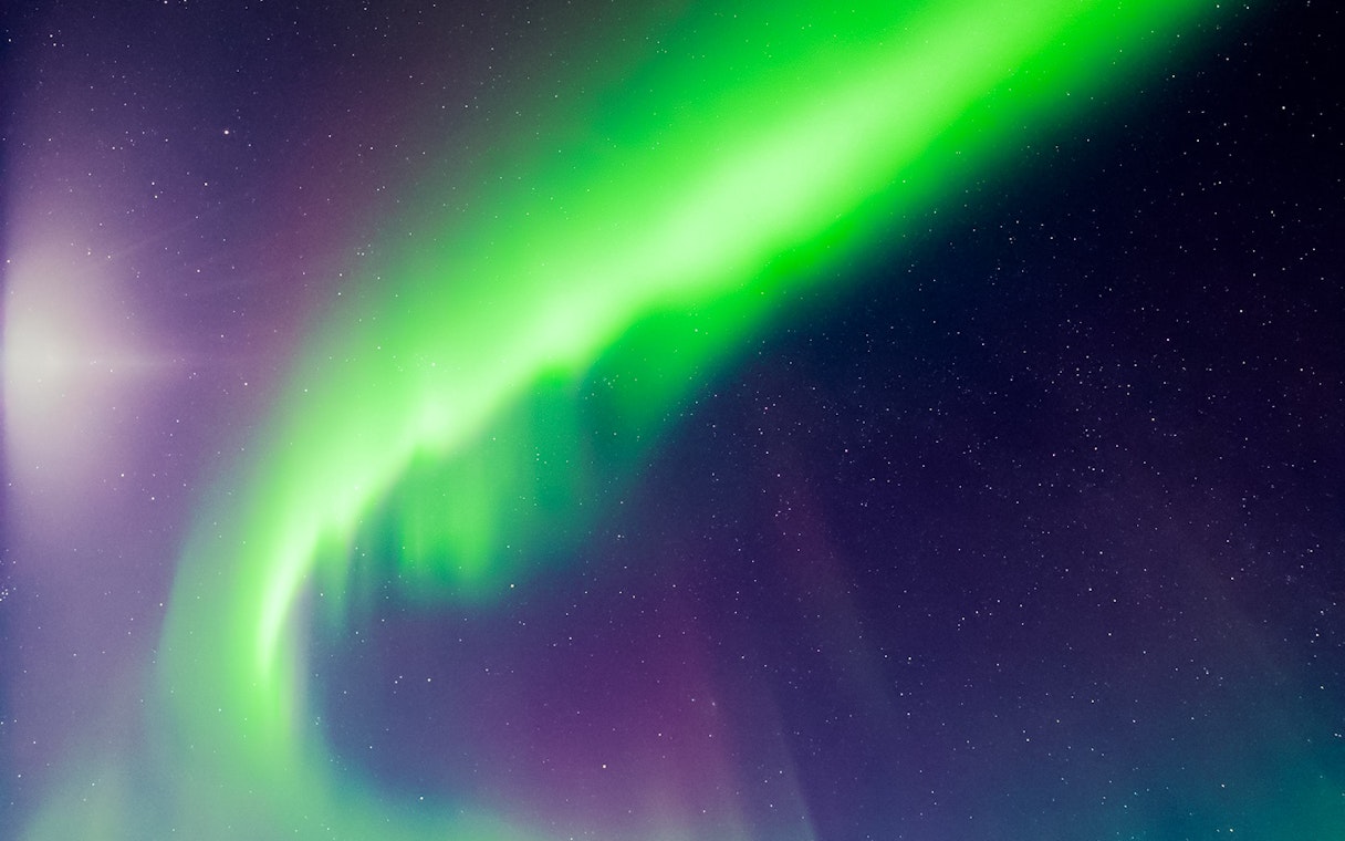 Northern lights illuminating the night sky in Levi, Finland.