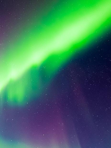 Northern lights illuminating the night sky in Levi, Finland.