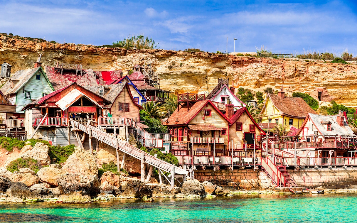 Popeye Village colorful wooden houses by the sea in Malta.