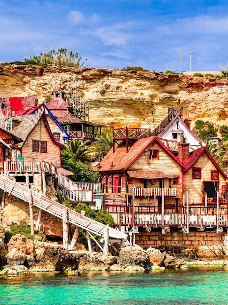 Popeye Village colorful wooden houses by the sea in Malta.