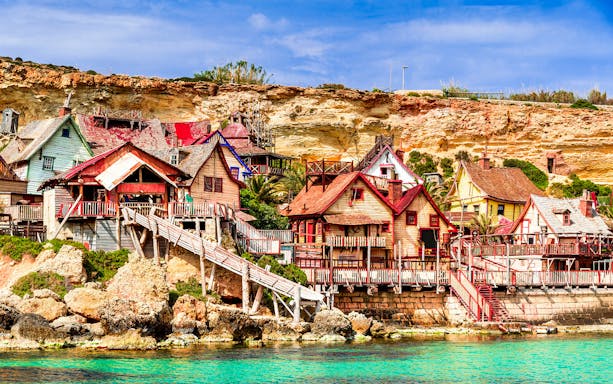 Popeye Village colorful wooden houses by the sea in Malta.