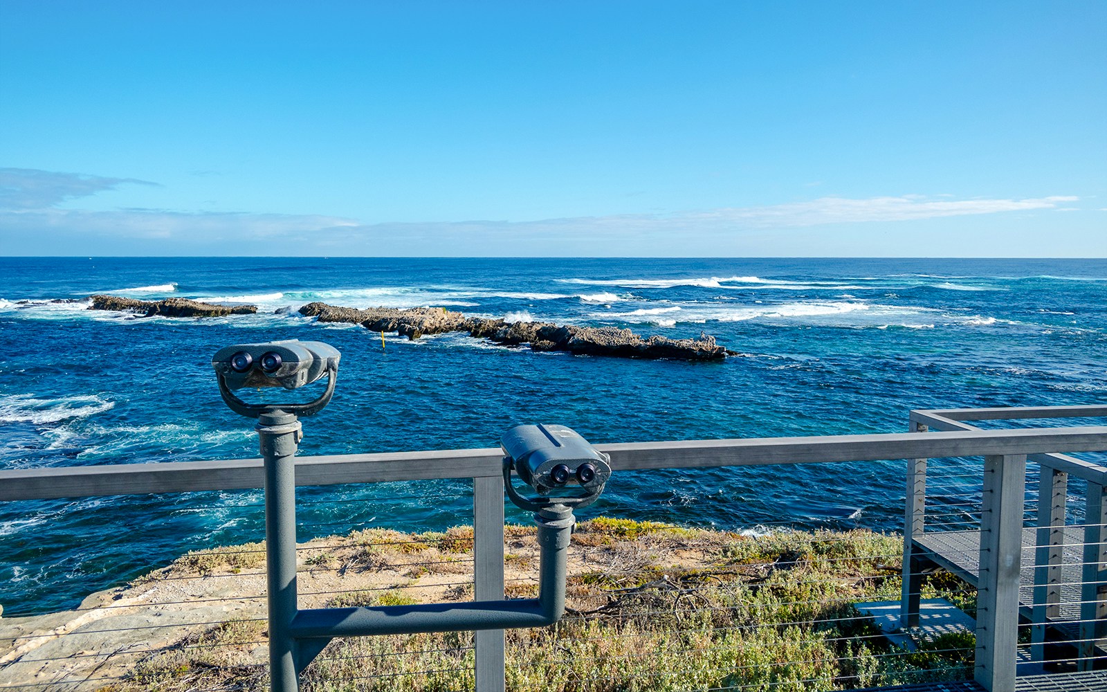 Lookout with binoculars overlooking ocean at Rottnest Island.