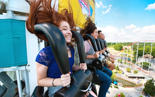 Riders enjoying the Dominator drop tower at Dorney Park, Six Flags.