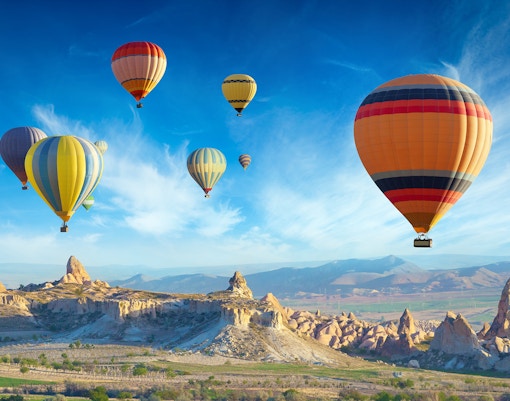Hot air balloon over Cappadocia landscape during Standard Hot Air Balloon Tour.