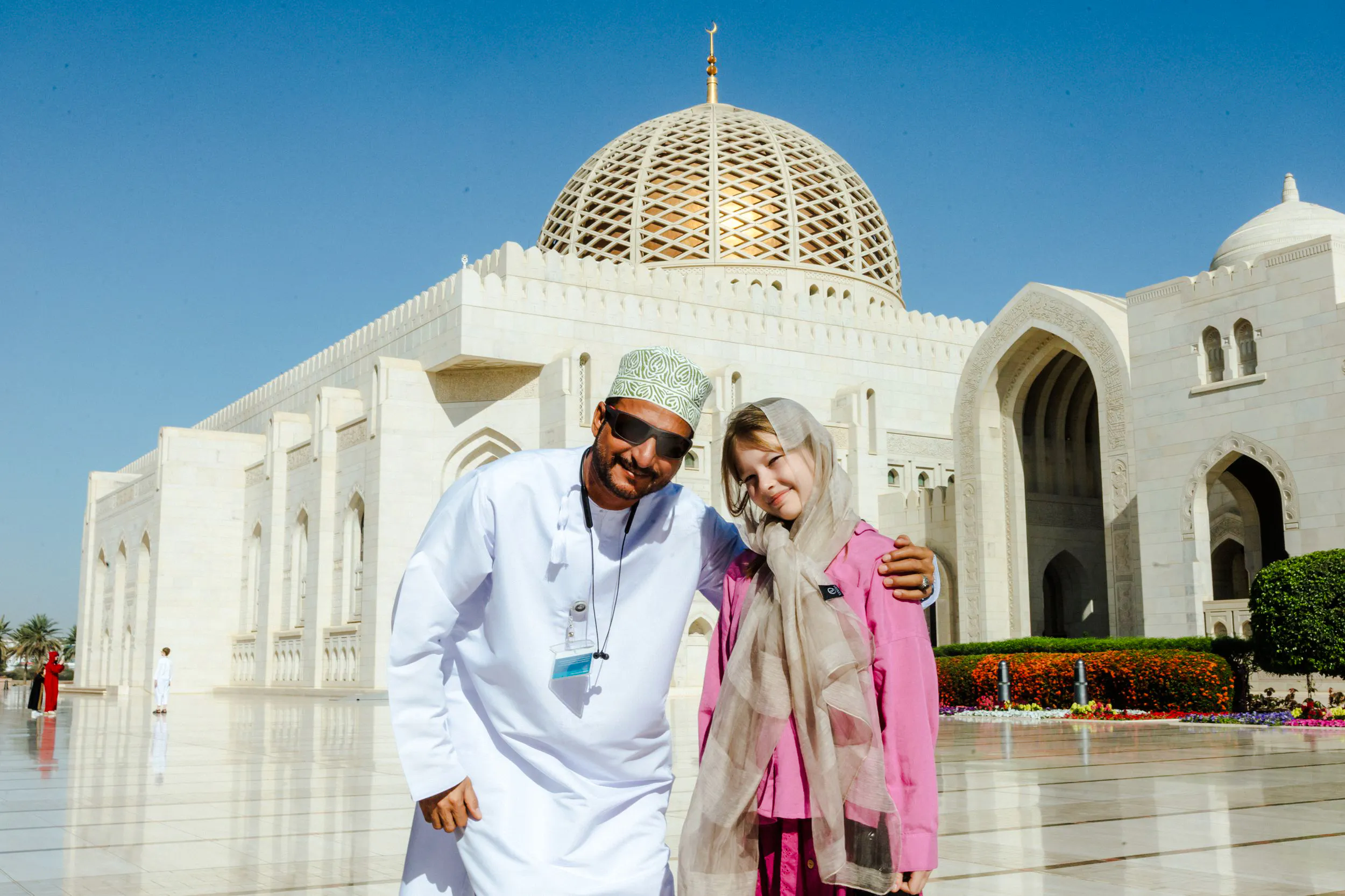 Tourists at Sultan Qaboos Grand Mosque, Muscat, during city highlights tour.