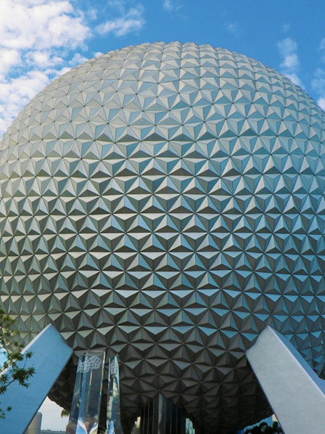 Spaceship Earth at EPCOT, Walt Disney World, Orlando, under a blue sky.