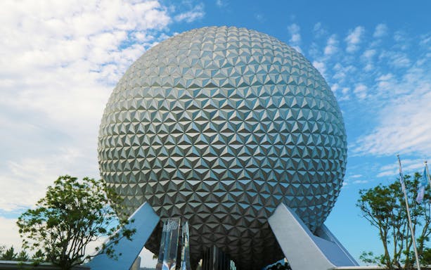 Spaceship Earth at EPCOT, Walt Disney World, Orlando, under a blue sky.