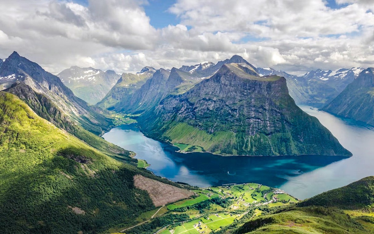 Aerial view of Hjørundfjord with surrounding mountains and water, Norway.
