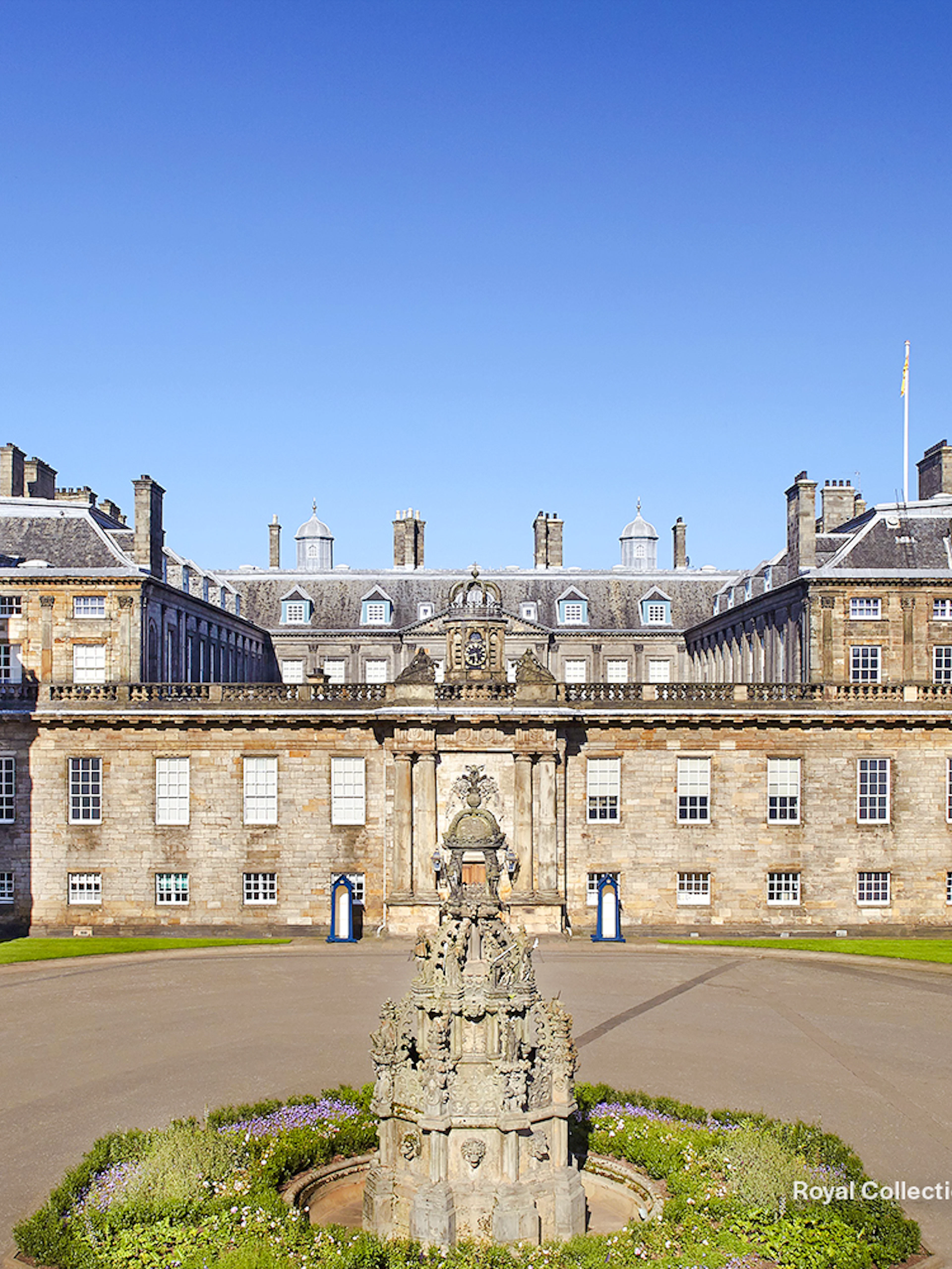 Palace of Holyroodhouse exterior with central fountain, Edinburgh, Scotland.