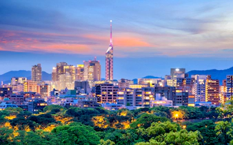 Fukuoka City skyline at dusk with Fukuoka Tower, Japan.
