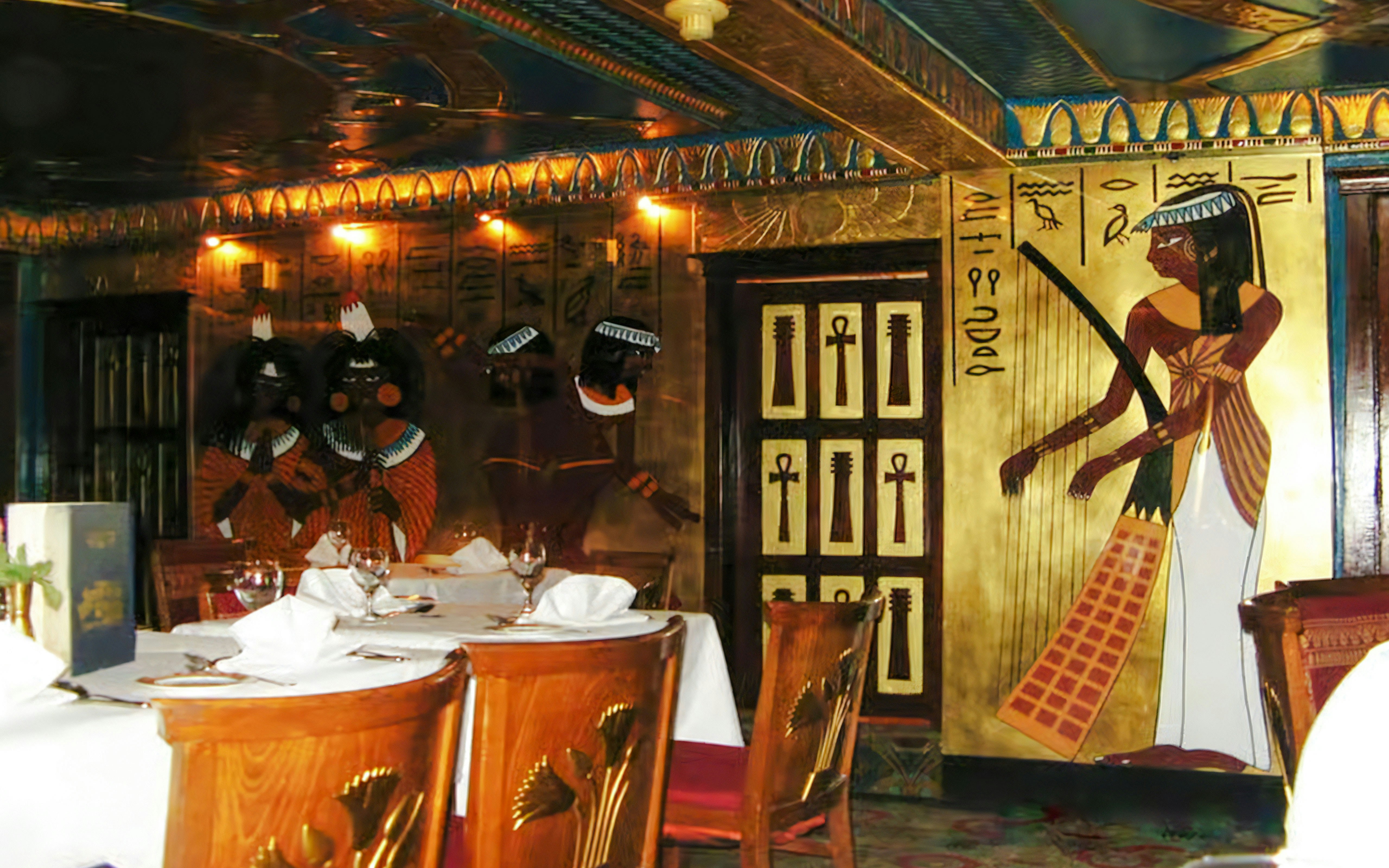 Dining area with Egyptian-themed decor on a Nile dinner cruise in Cairo.