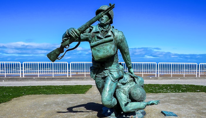 Statue of soldiers at Normandy Beach, France, commemorating D-Day.