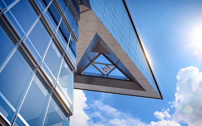 Modern glass building with sky view from Edge observation deck.