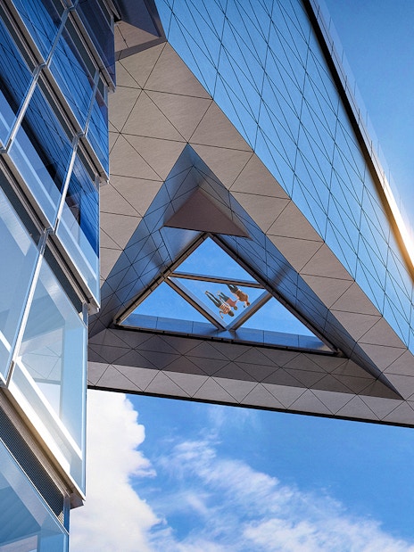 Modern glass building with sky view from Edge observation deck.