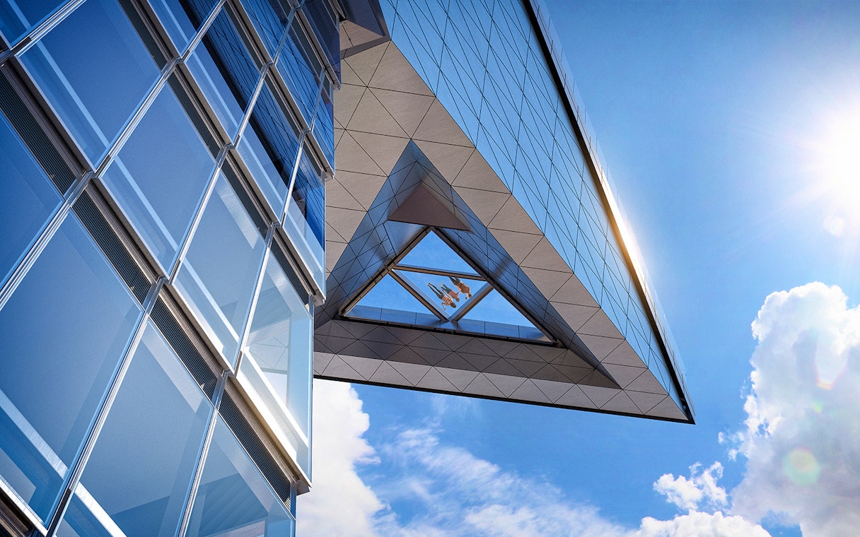 Modern glass building with sky view from Edge observation deck.