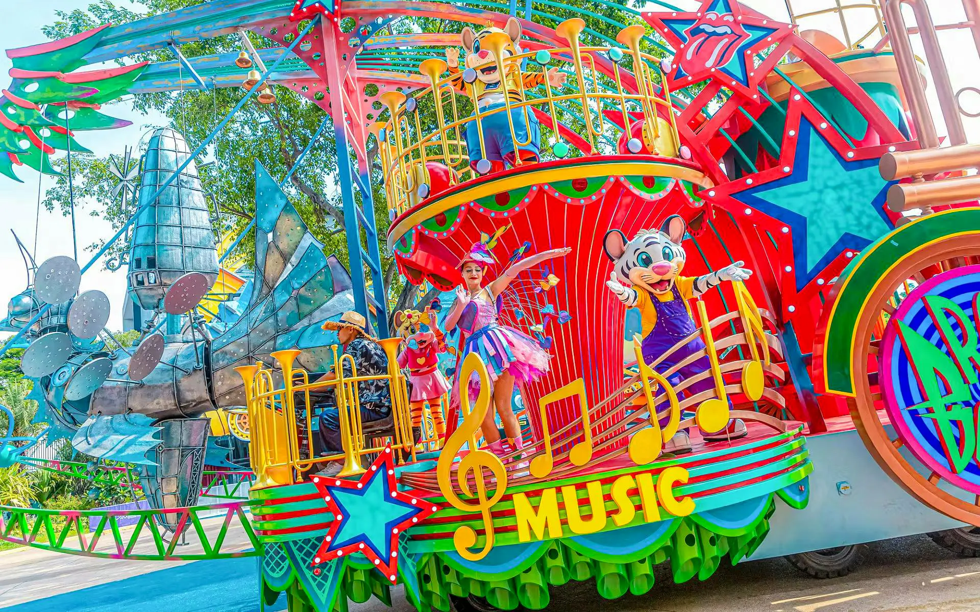 Colorful parade float with performers and characters at Chimelong Paradise.