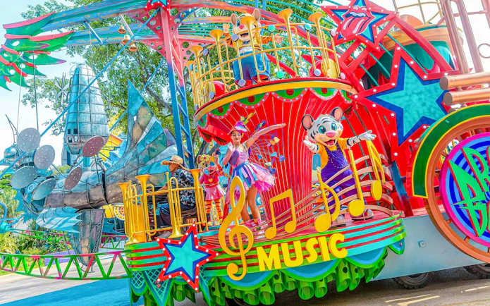 Colorful parade float with performers and characters at Chimelong Paradise.